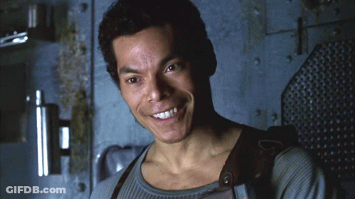 Smiling Man In Front Of Wall GIF