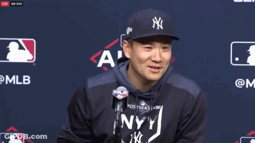 Smiling Man In NY Yankees Hat And Hoodie GIF