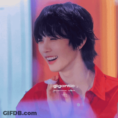 Smiling Man In Red Shirt Saying Gigantic GIF