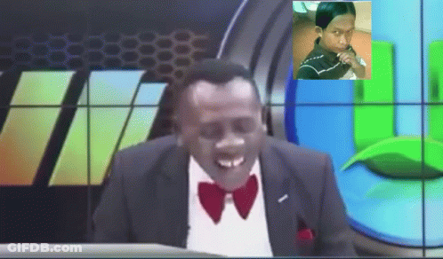 Smiling Man In Suit And Bow Tie At Screen GIF