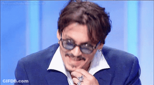 Smiling Man In Suit And Sunglasses Holding Chin GIF