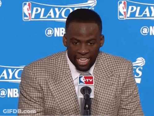 Smiling Man In Suit At NBA Logo Microphone GIF