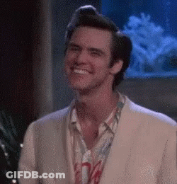 Smiling Man In Suit By Fish Tank GIF