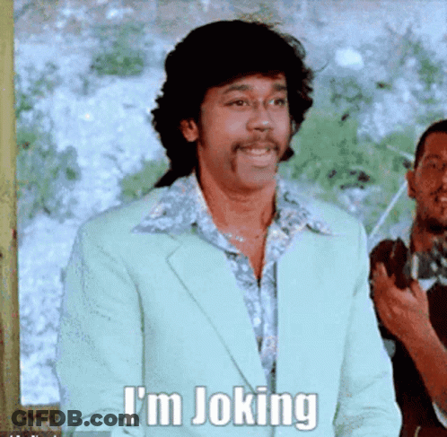 Smiling Man In Suit Says I'm Joking GIF