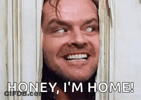 Smiling Man Looking Through Door Honey I'm Home GIF