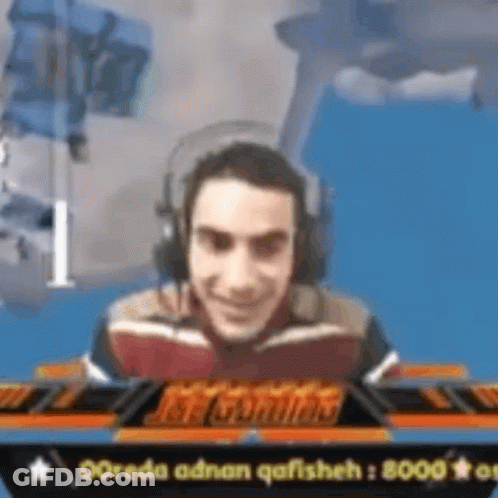 Smiling Man Playing Video Game With Headphones GIF
