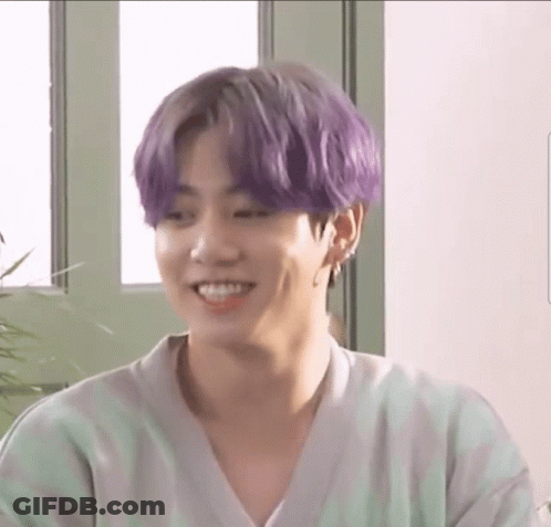 Smiling Man Purple Hair Green White Striped Shirt GIF