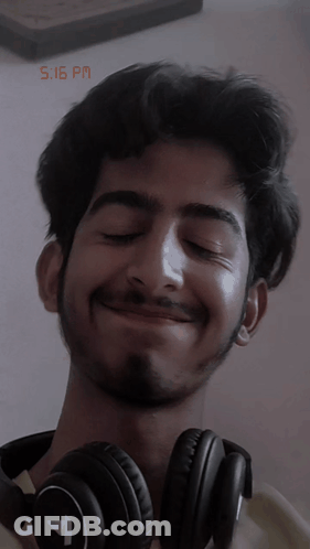 Smiling Man Wearing Headphones GIF