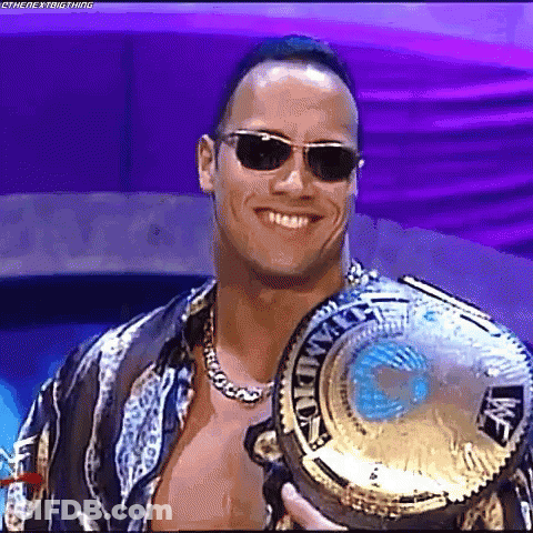 Smiling Man Wearing Sunglasses And Championship Belt GIF