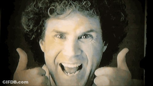 Smiling Man With Curly Hair Giving Thumbs Up GIF