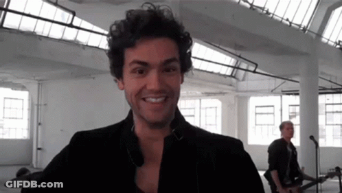 Smiling Man With F On Shirt Black And White GIF