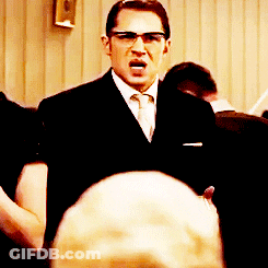 Smiling Man With Glasses And Beard At Homeland Security Sign GIF