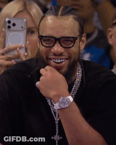 Smiling Man With Glasses And Diamond Necklace GIF