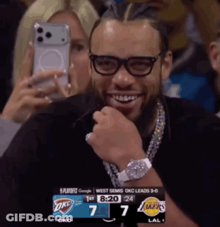 Smiling Man With Glasses And OKC Scoreboard GIF
