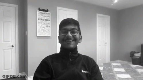 Smiling Man With Glasses, Bench Jacket Dream Big GIF