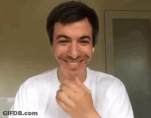 Smiling Man With Hand On Chin GIF