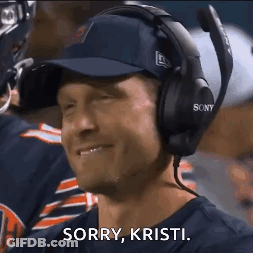 Smiling Man With Headphones And Hat Saying Sorry Kristi GIF