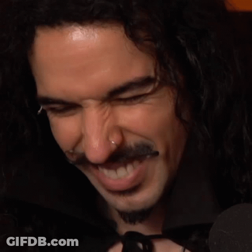 Smiling Man With Long Curly Hair And Beard GIF