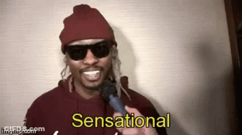 Smiling Man With Sunglasses And Beanie Holding Microphone GIF