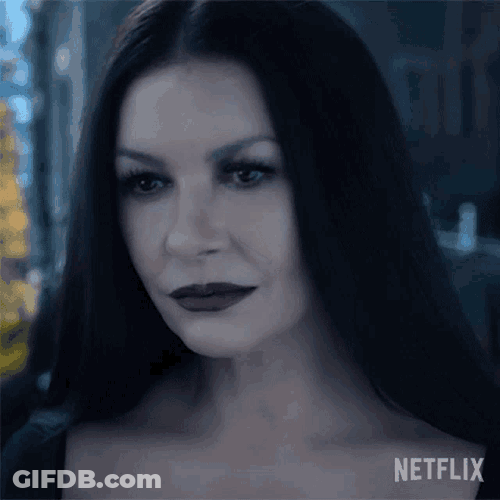 Smiling Morticia Addams GIF