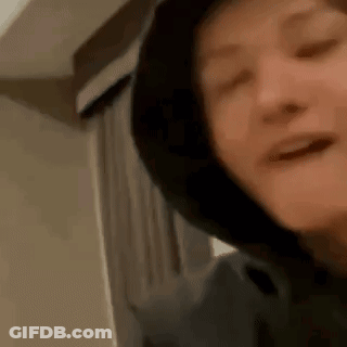 Smiling Person In Hoodie GIF