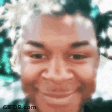 Smiling Person's Blurry Face GIF
