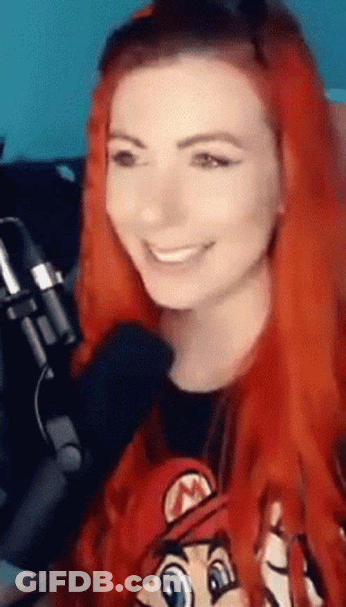 Smiling Red Hair Girl Watching You GIF
