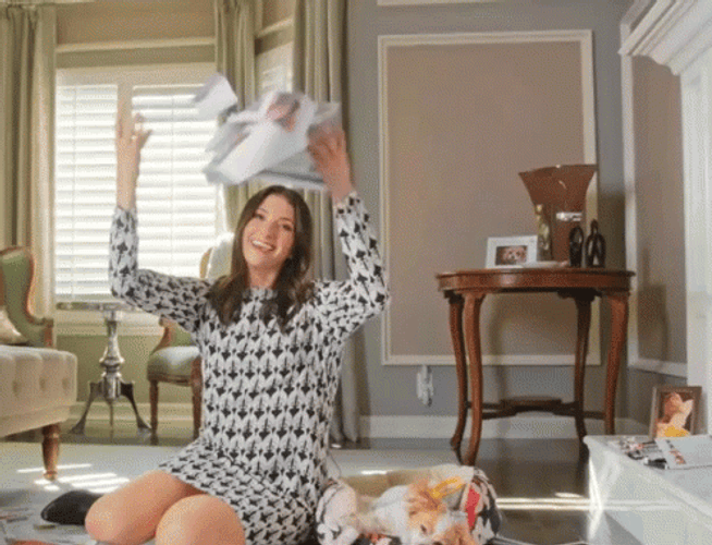 Smiling Then Throwing Papers GIF