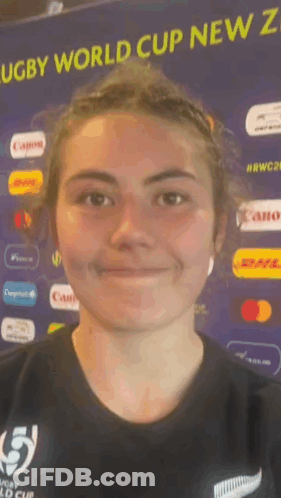 Smiling Woman By Rugby World Cup New Zealand Sign GIF