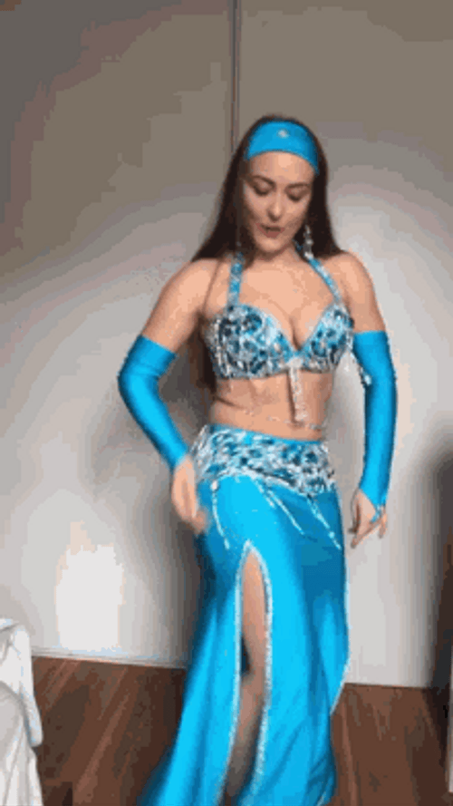 Smiling Woman Doing Belly Dance GIF