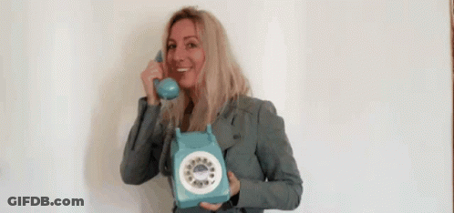 Smiling Woman Holding Blue Telephone GIF