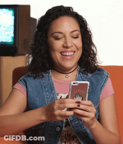 Smiling Woman Holding Cell Phone GIF