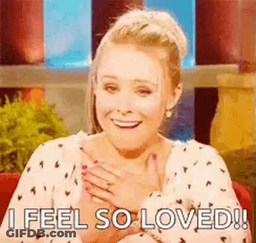 Smiling Woman Holding Hands On Chest GIF