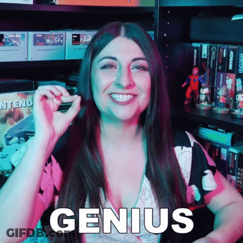 Smiling Woman Holding Small Object By Genius Shelf GIF