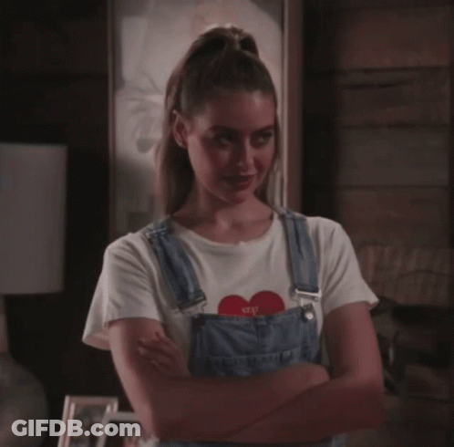 Smiling Woman In Earrings And Black Shirt GIF