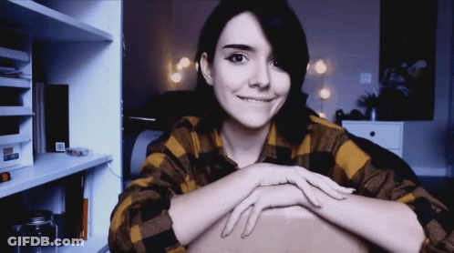 Smiling Woman In Plaid Shirt GIF