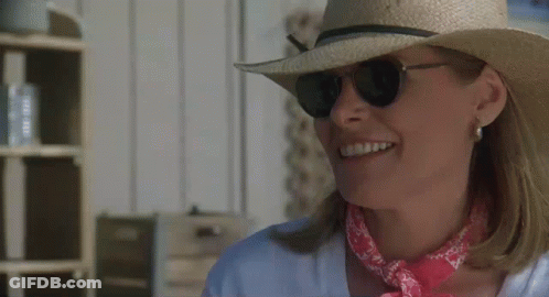 Smiling Woman In Straw Hat And Sunglasses With Pink Bandana GIF