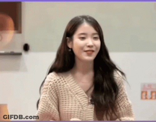 Smiling Woman In Sweater GIF