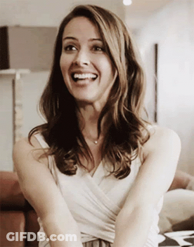 Smiling Woman In White Tank Top GIF