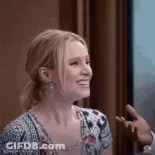 Smiling Woman Sitting By Window GIF
