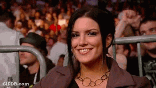 Smiling Woman Sitting In Boxing Ring Stands GIF