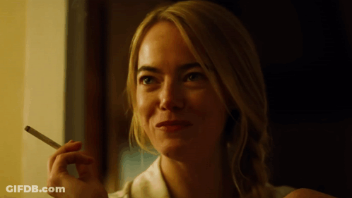Smiling Woman Smoking Cigarette GIF