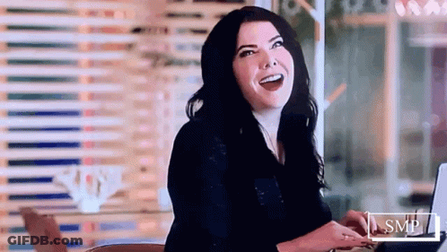 Smiling Woman Using Laptop GIF