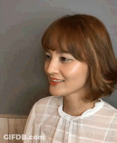 Smiling Woman With Brown Hair And Red Lipstick GIF