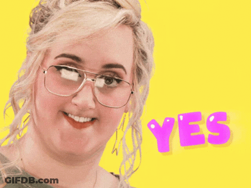 Smiling Woman With Glasses Saying Yes GIF
