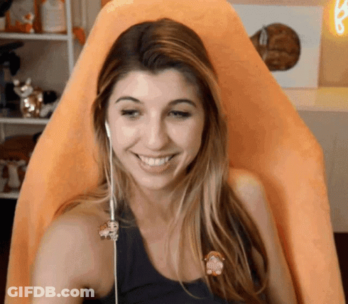 Smiling Woman With Headphones And Monkey Pin GIF