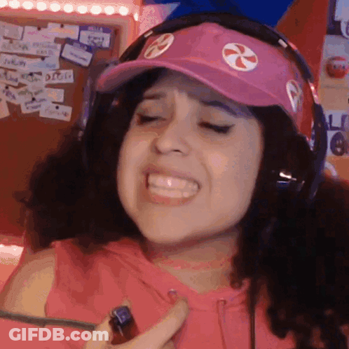 Smiling Woman With Headphones And Pink Hat Holding Lighter GIF