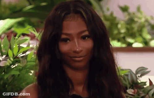 Smiling Woman With Long Dark Hair And Nose Ring GIF