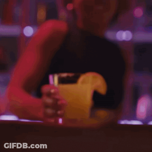 Smiling Woman With Ponytail Holding Coffee GIF