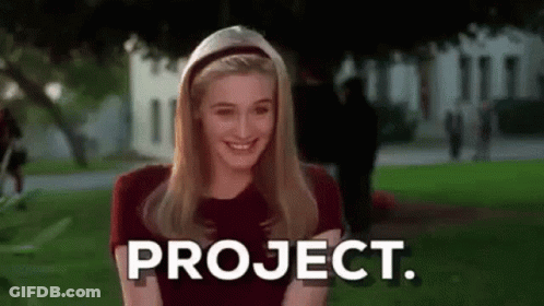 Smiling Woman With Project On Face GIF